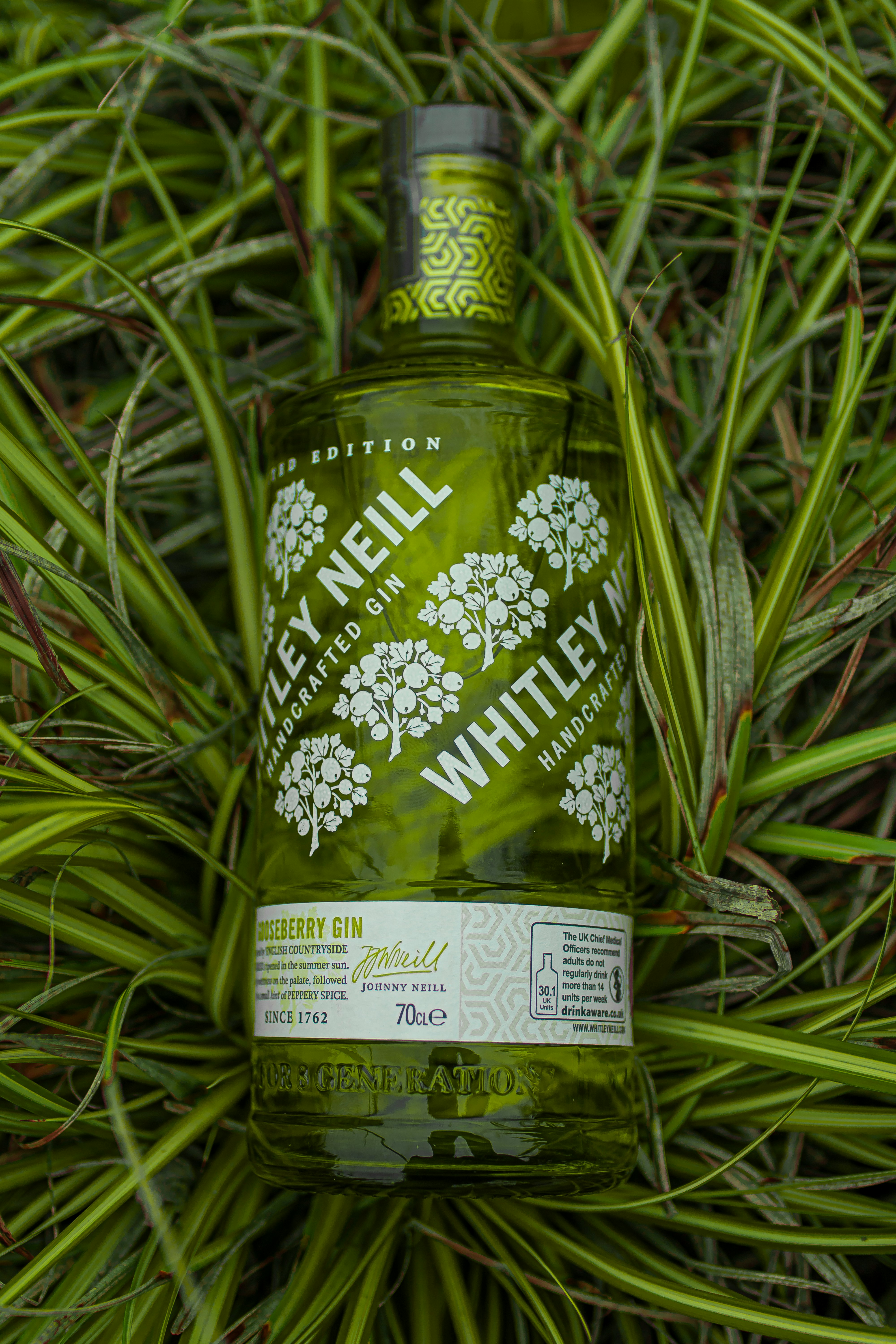 green and white floral bottle